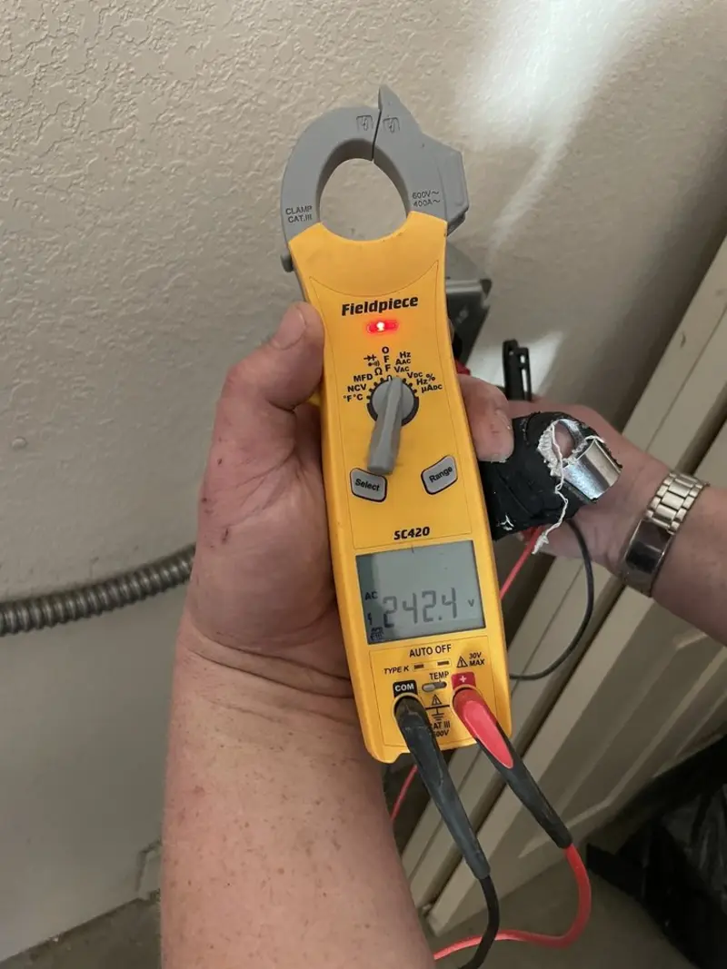 Voltage testing with clamp meter during Recessed Lighting Installation in Randolph